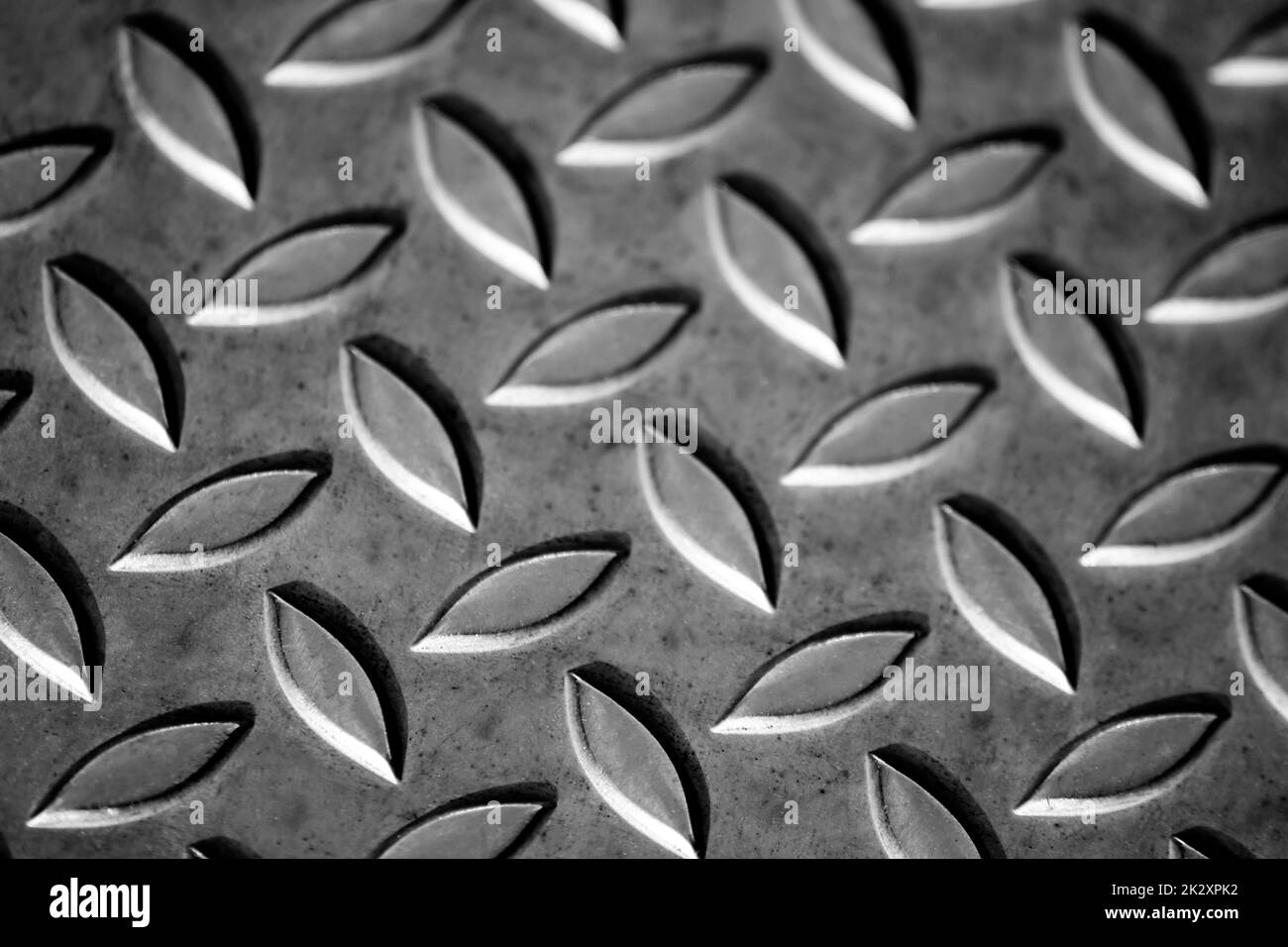Solid diamond metal plate surface shows stainless steel flooring in industrial manufactury as steampunk background for metal stairs and heavy steel plates for protection and heavy armour army vehicles Stock Photo