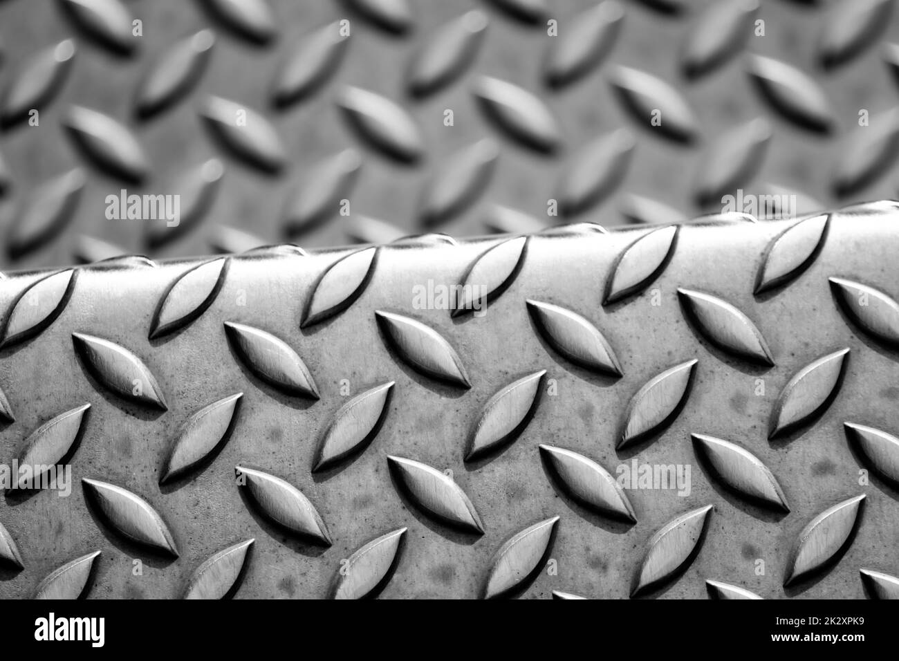 Solid diamond metal plate surface shows stainless steel flooring in industrial manufactury as