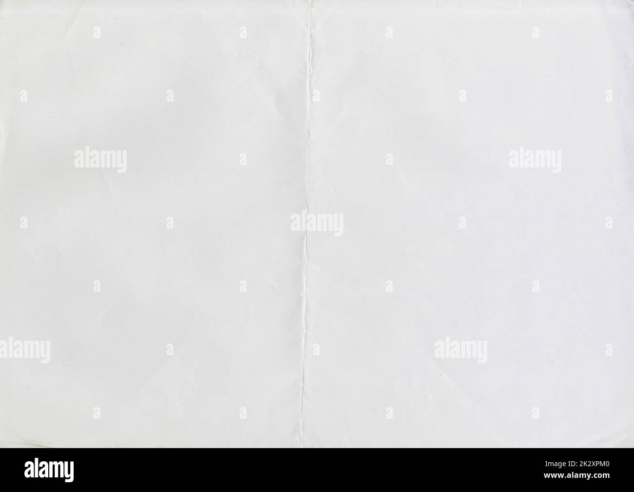 High resolution large image of white paper texture background scan folded in half, soft fine grain uncoated paper for water colors with copy space for text material mockup or presentation wallpaper Stock Photo