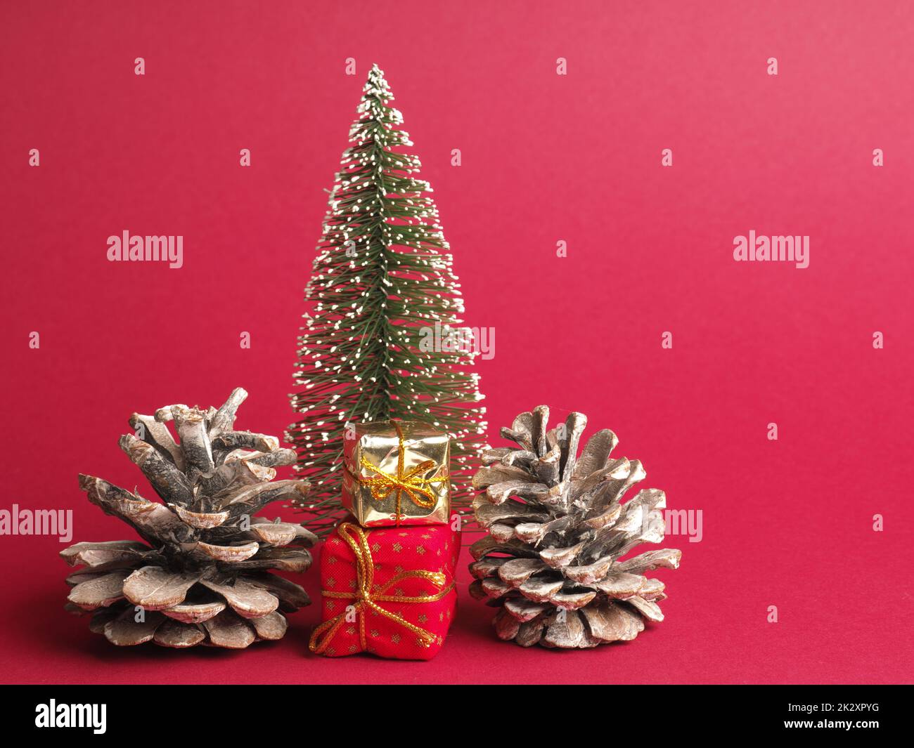 Christmas decoration with pine cones and gift boxes Stock Photo
