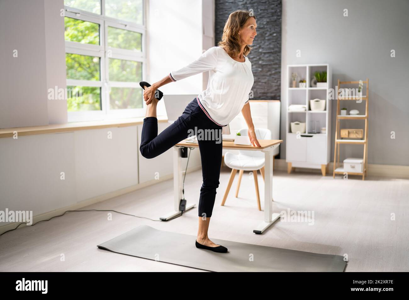 Stretching exercise desk hi-res stock photography and images - Alamy