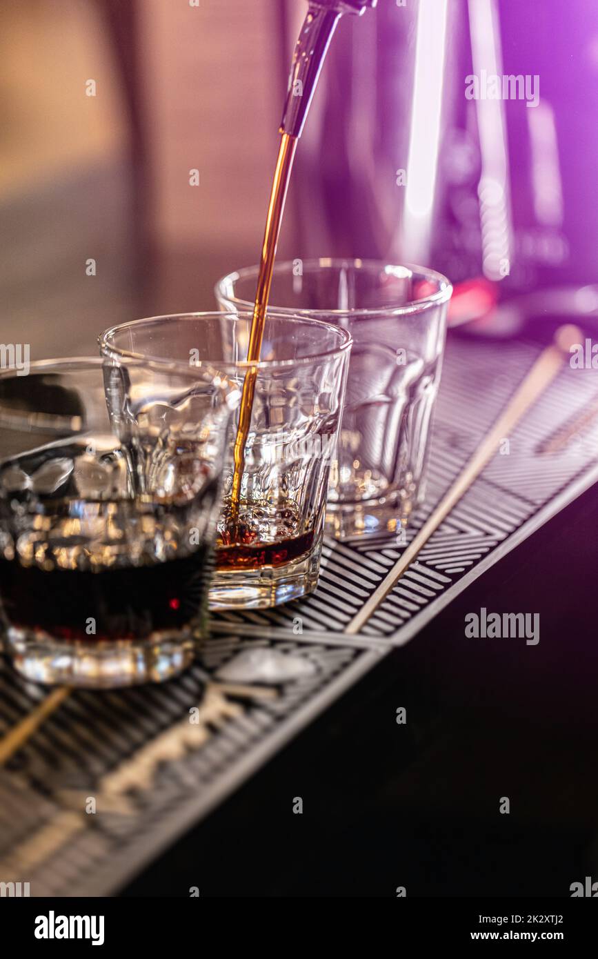 Barman pouring fresh alcoholic drink Stock Photo
