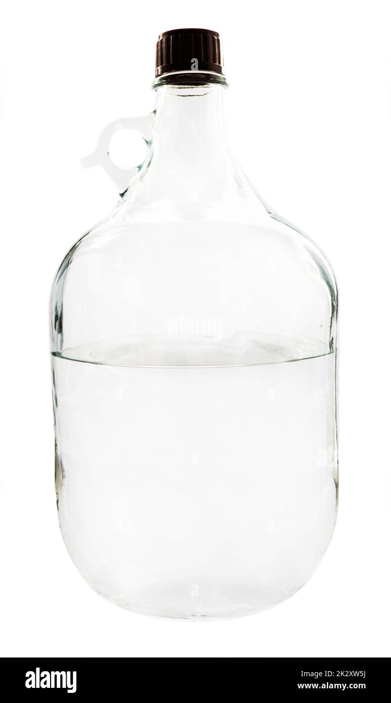 five-liter glass bottle with alcohol isolated Stock Photo