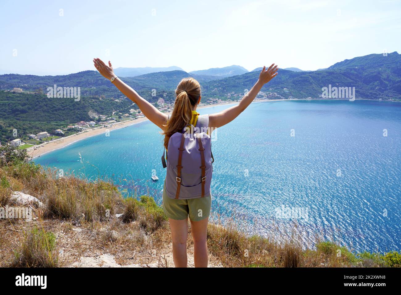 Successful hiking woman on top of mountains, motivation and inspiration