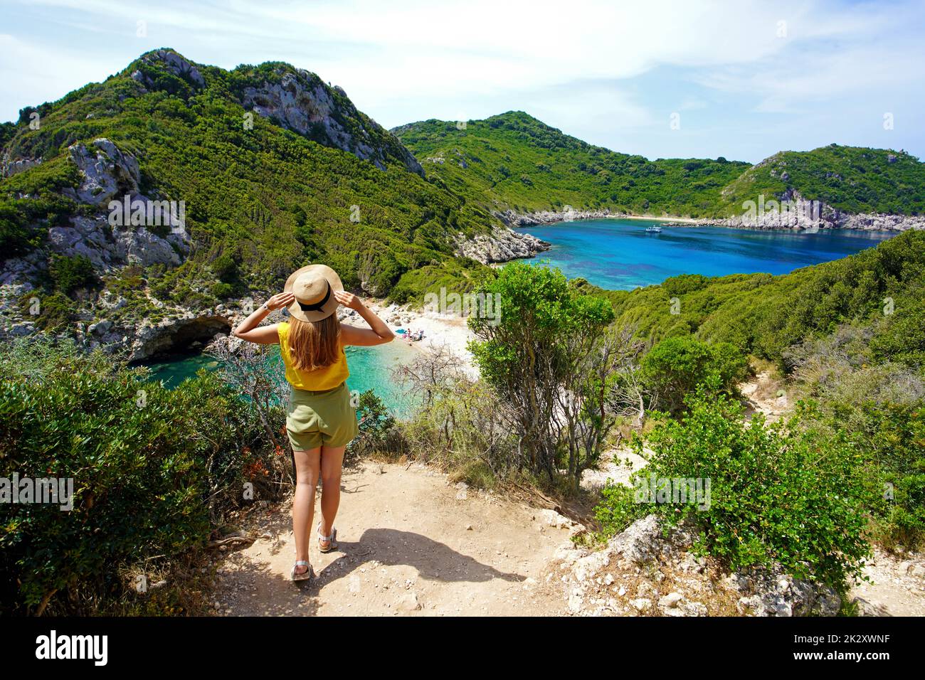 Tourism in Greece. Female hiker looking amazing landscape of Porto Timoni on Corfu Island, Greece. Stock Photo
