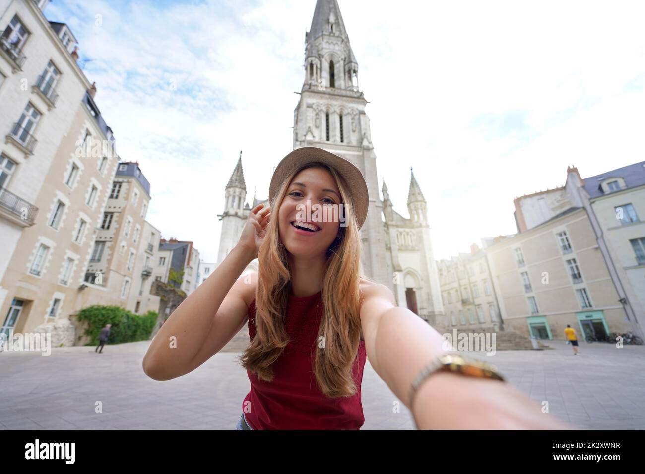 Happy tourist girl takes self portrait in the city of Nantes, France Stock Photo