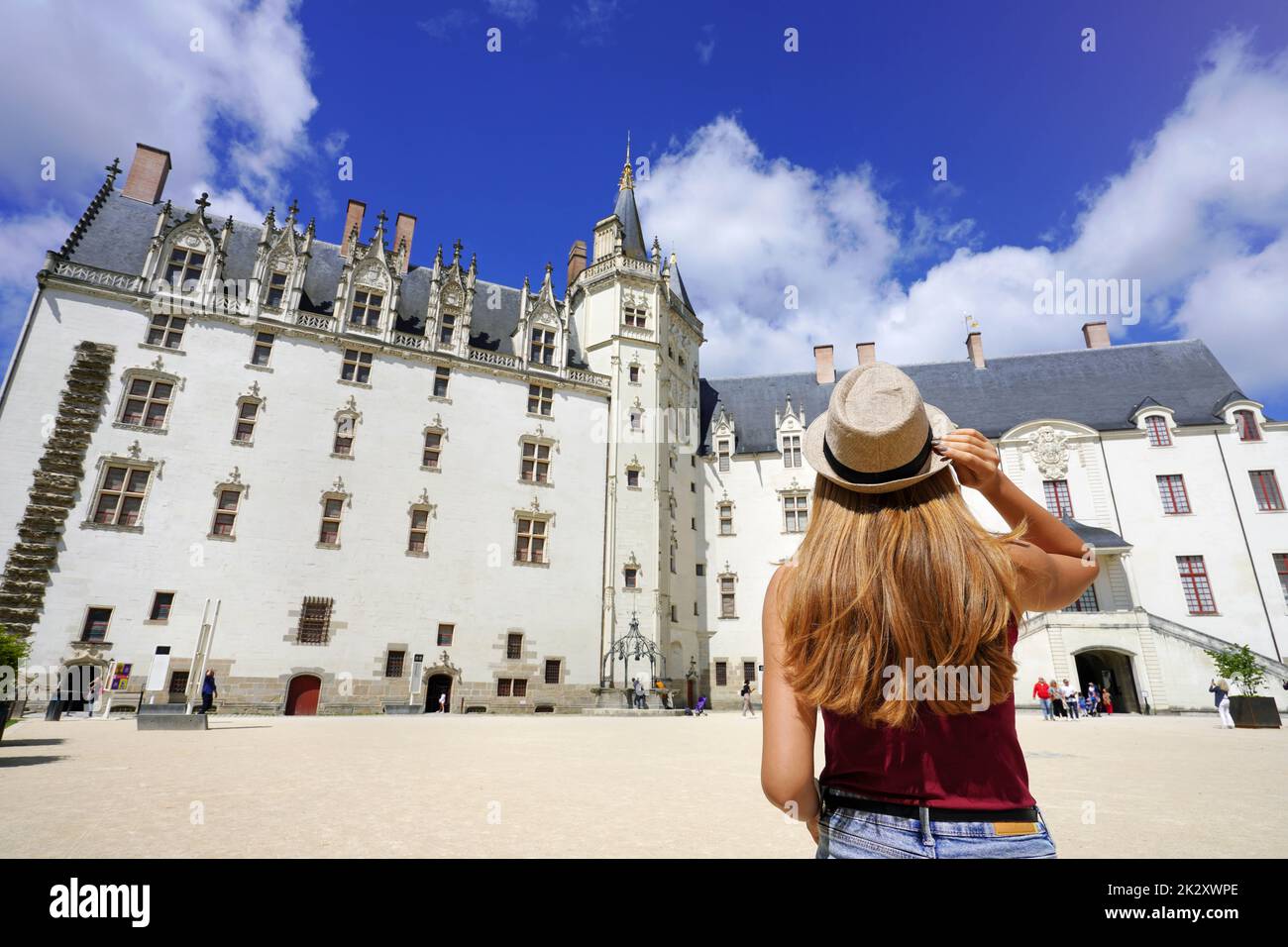 Young traveler woman visiting the ChÃ¢teau des ducs de Bretagne a castle in the city of Nantes, France Stock Photo