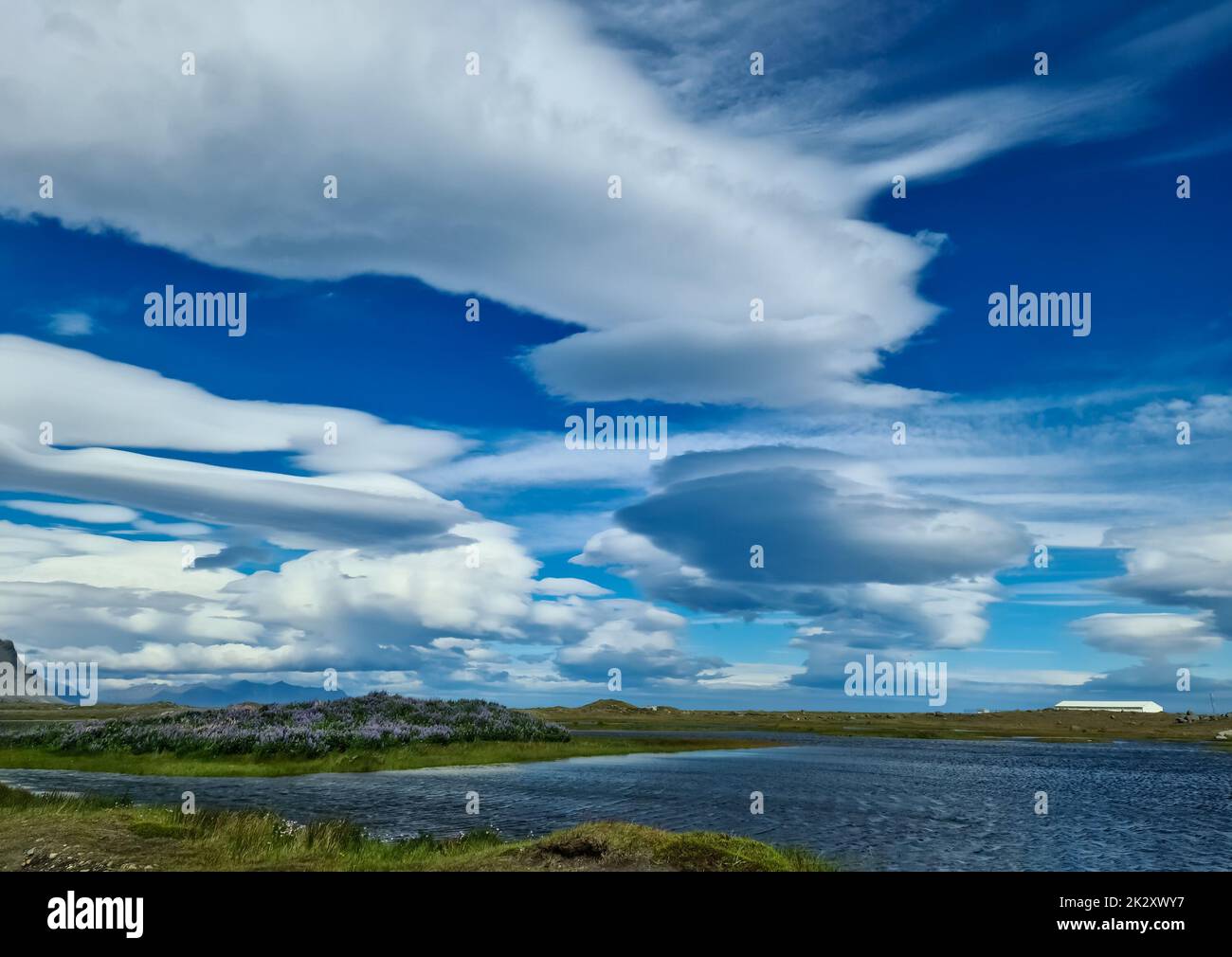 Spectacular UFO clouds in the sky over Iceland - Altocumulus Lenticularis. Stock Photo