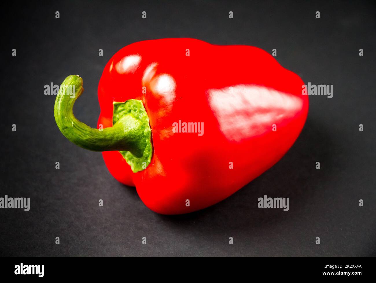 Red bell pepper isolated on black background Stock Photo