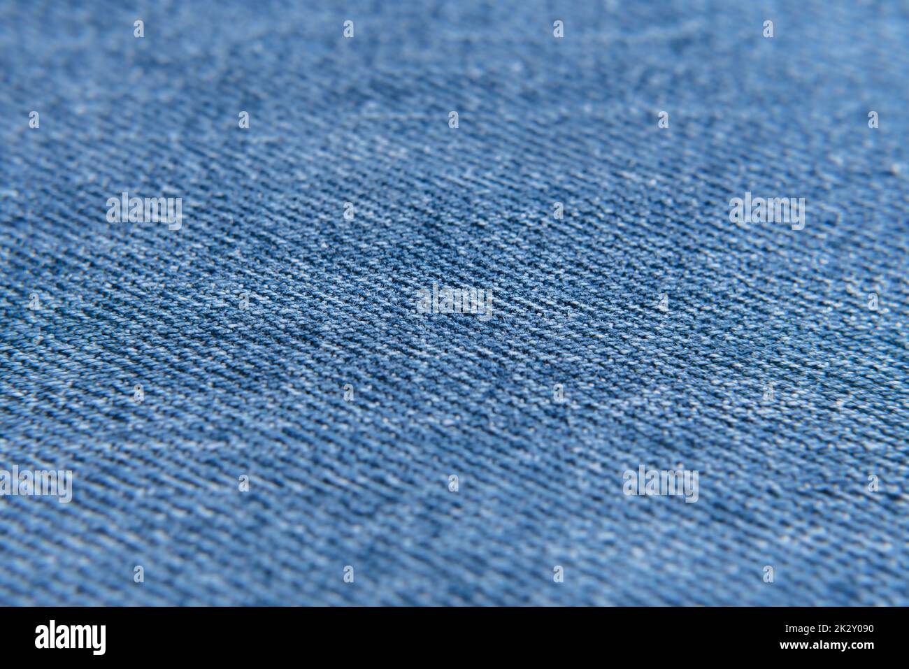 Light blue jeans background, with selective focus. Denim texture. Stock Photo