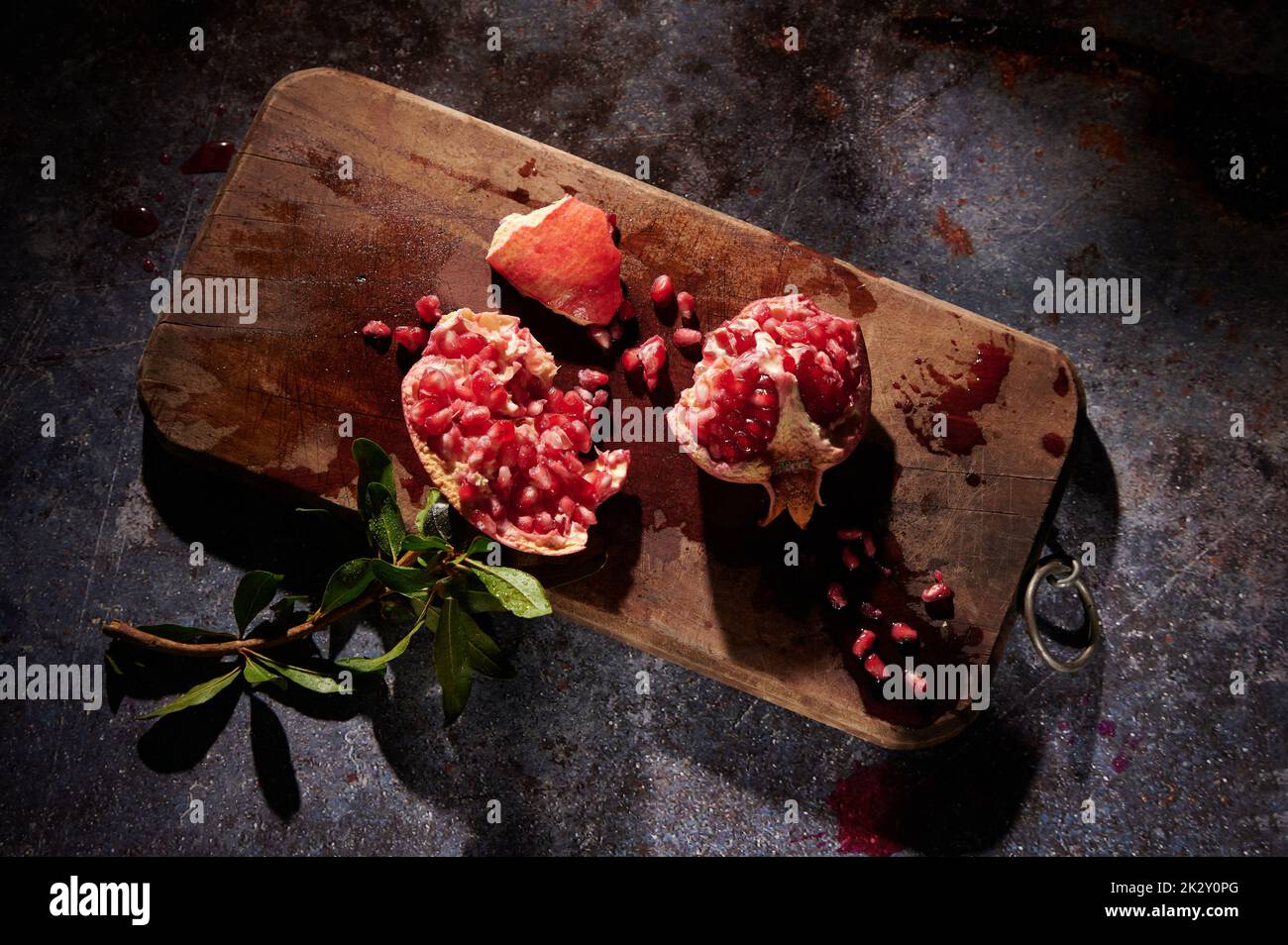 Fresh pomegranate on cutting board Stock Photo