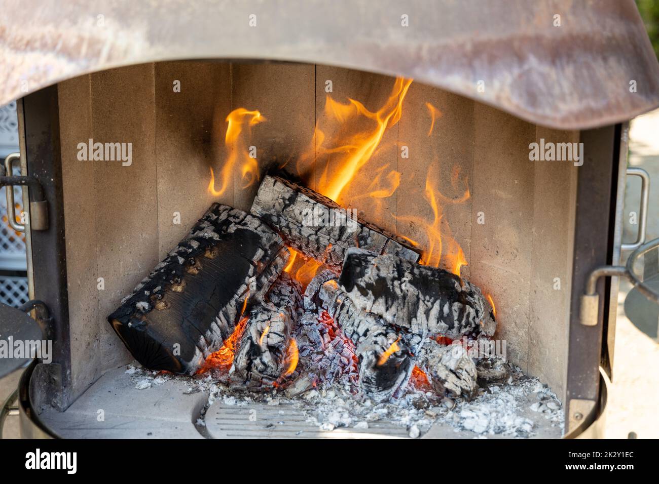 Burning wood in a fireplace with a lot of embers Stock Photo Alamy