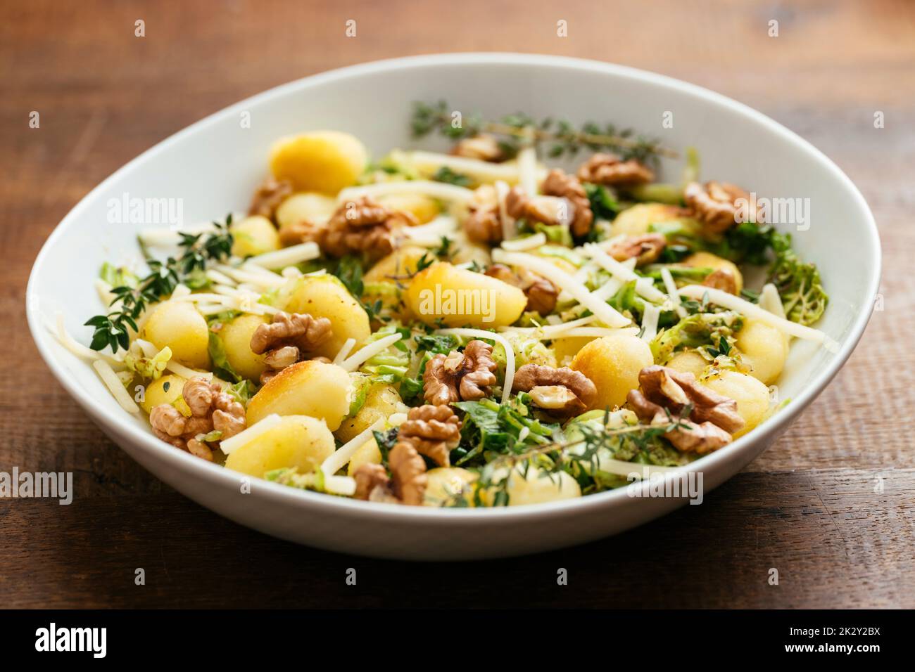 Home made Gnocchi with Savoy Cabbage and Walnuts Stock Photo