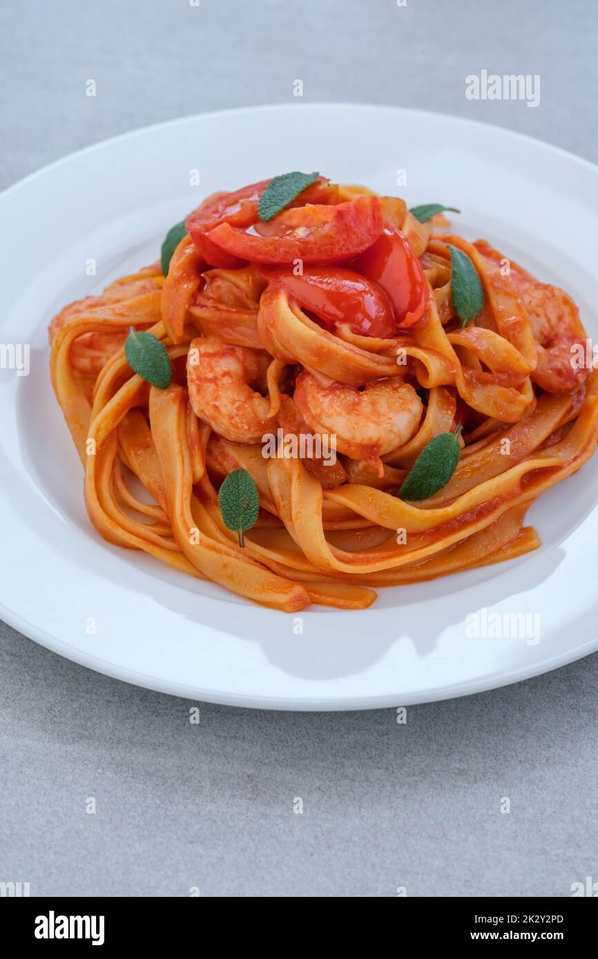 Tomato garlic shrimp tagliatelle pasta Stock Photo - Alamy