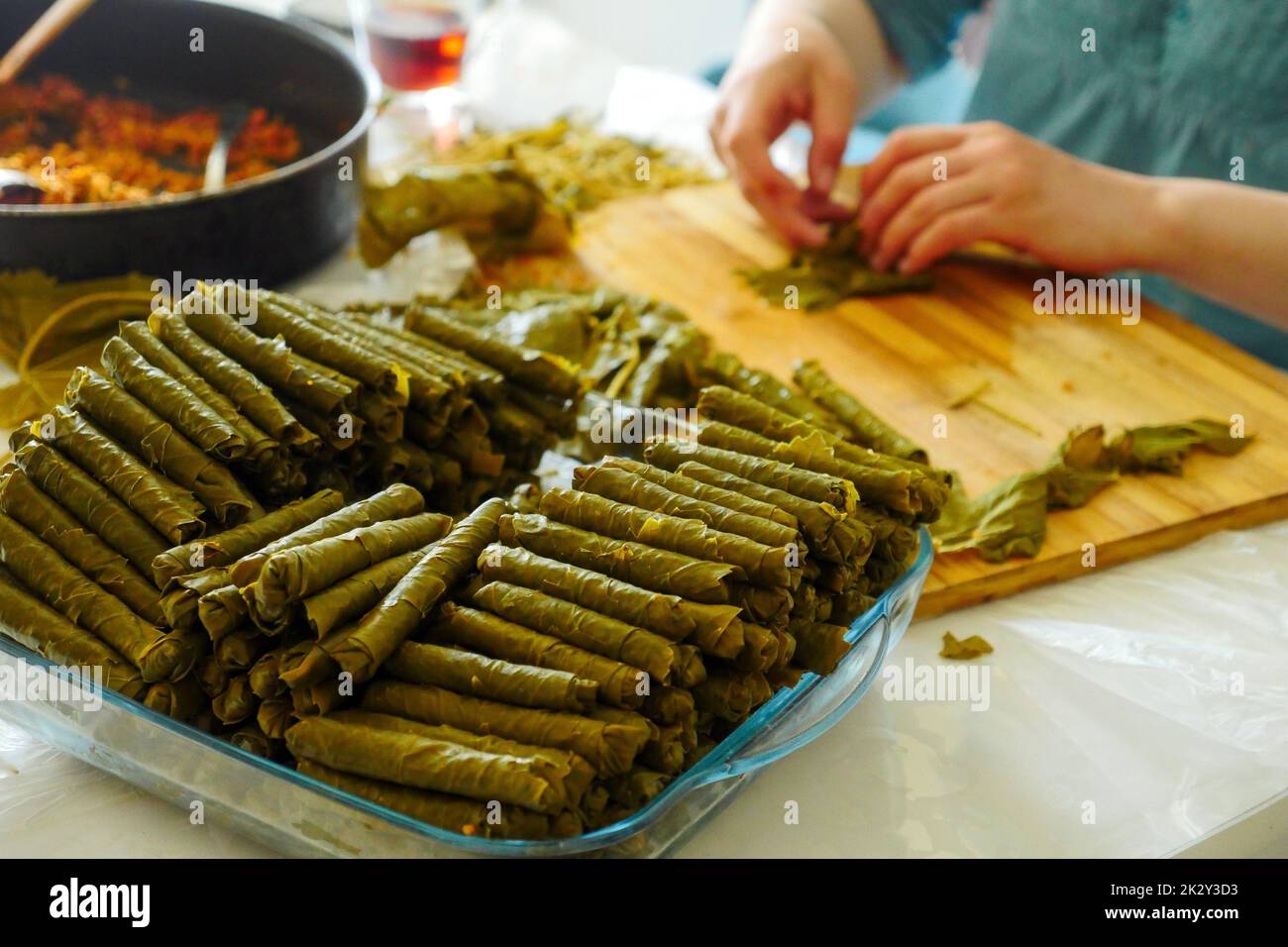 a cook making stuffed leaves, making stuffed leaves at home, stuffed leaves from Turkish cuisine Stock Photo