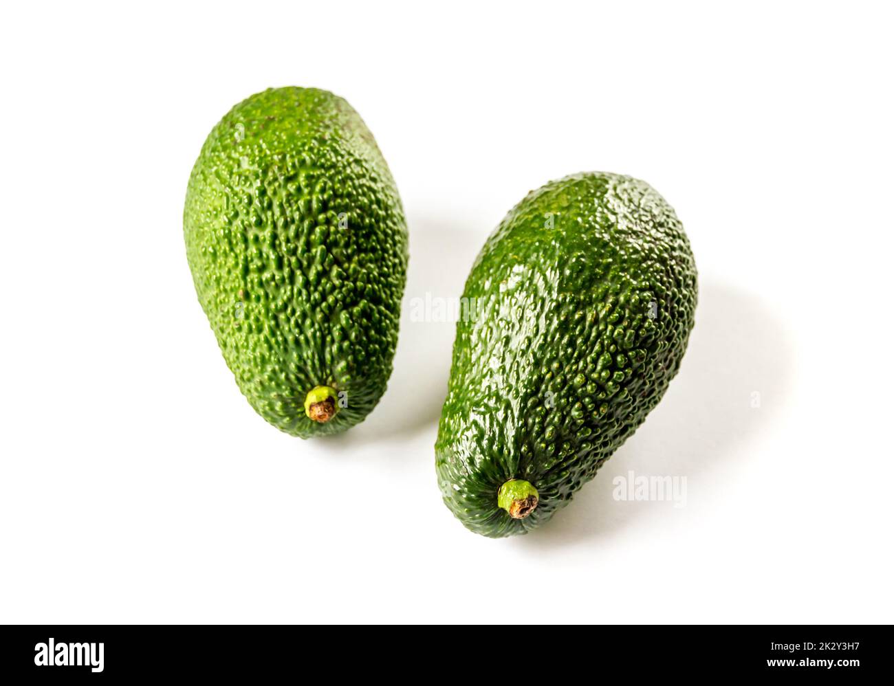 Two avocados isolated on a white background Stock Photo