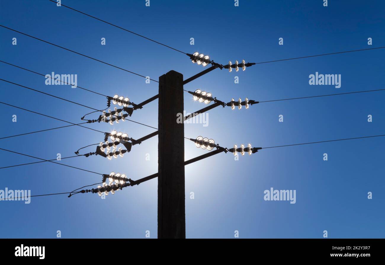 Electrical power line against sunshine Stock Photo