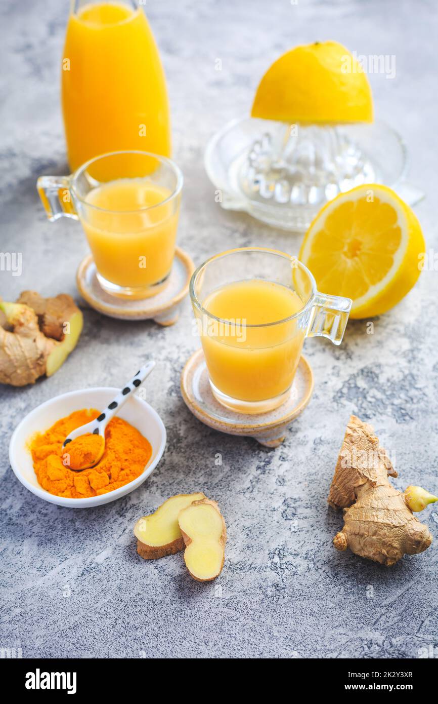 Close up of healthy Ginger Lemon Turmeric Shot Â– ideal to boost the immune system Stock Photo