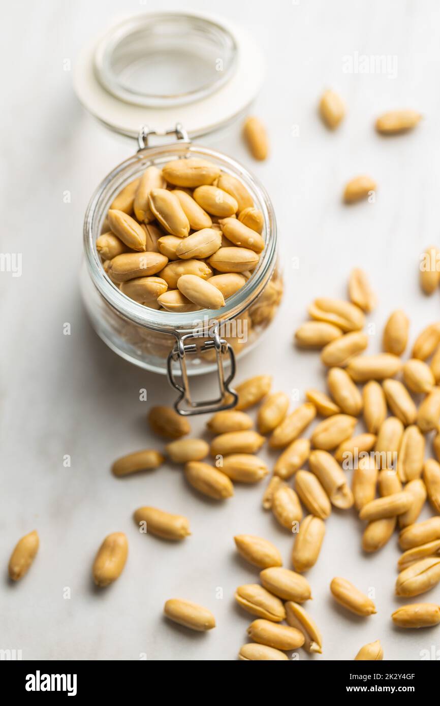 Roasted peeled peanuts in jar Stock Photo Alamy