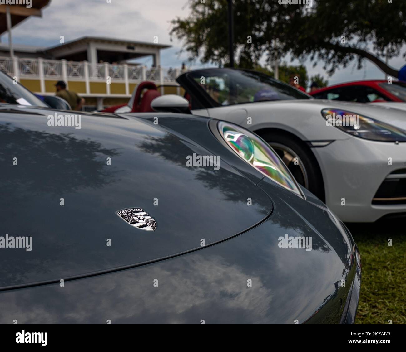 A row of vintage Porsche cars at an exhibition in Cocoa Village