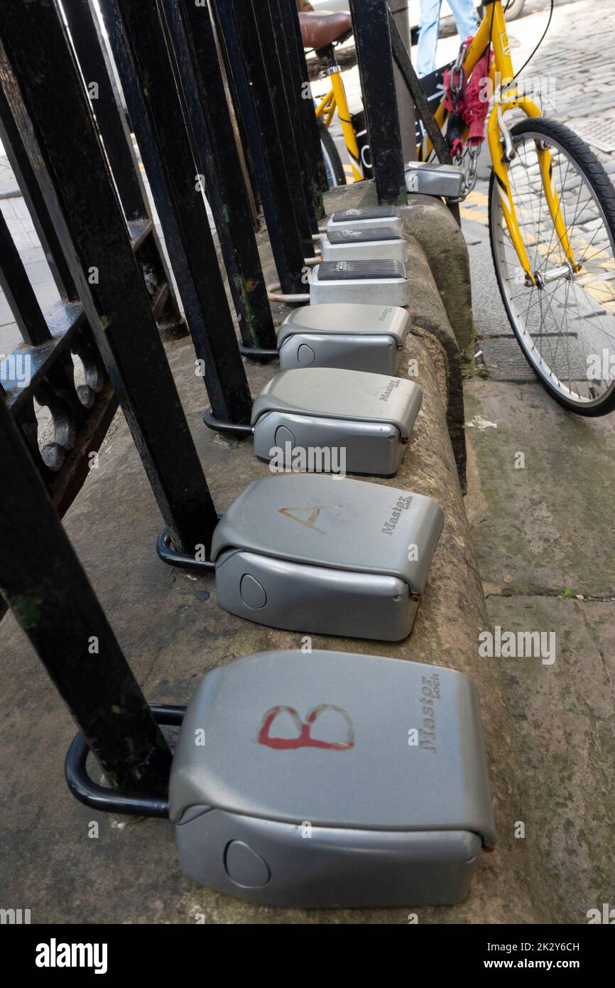 Many key safes for Airbnb short term lets outside apartment building in