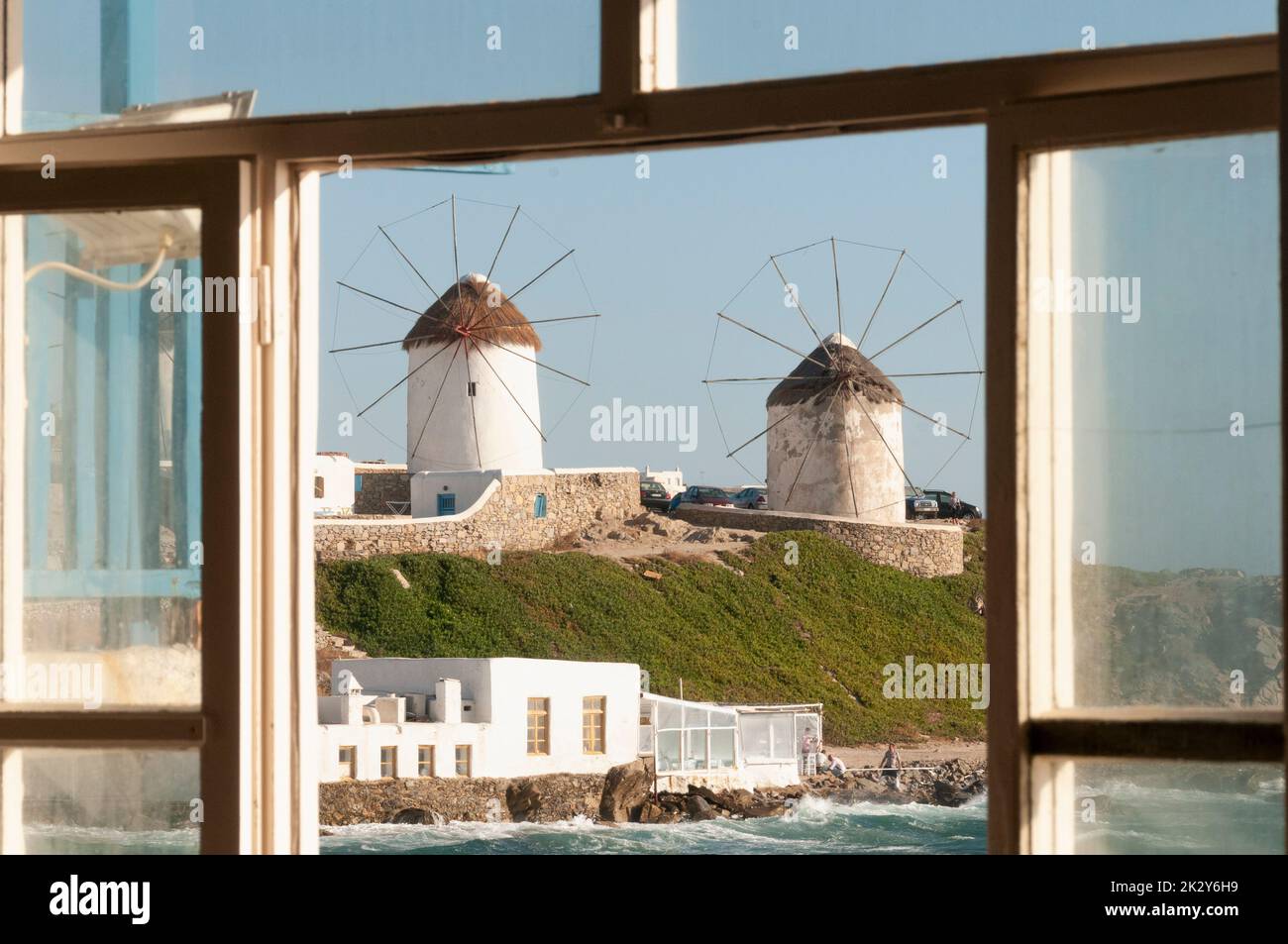 Panoramic view from a window of historic mills on the island of Mykonos, Greece Stock Photo