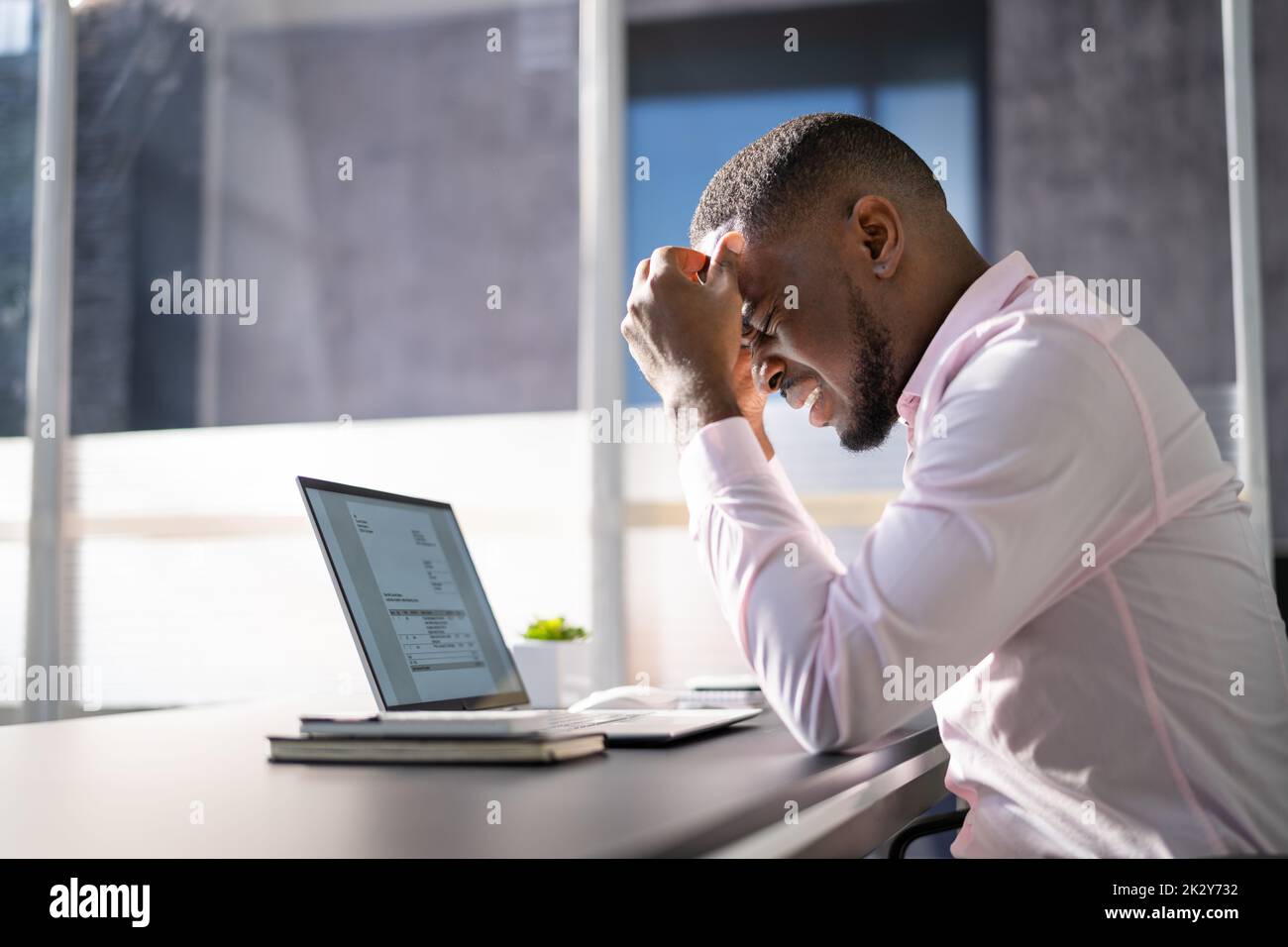 Stressed Sick African American Employee Man At Computer Stock Photo
