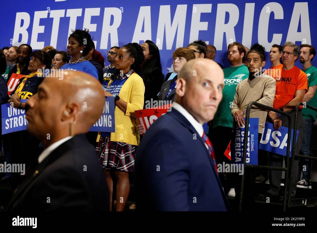 People look on as U.S. President Joe Biden delivers remarks at a Democratic National Committee event at the National Education Association headquarters in Washington, U.S., September 23, 2022. REUTERS/Evelyn Hockstein Stock Photo