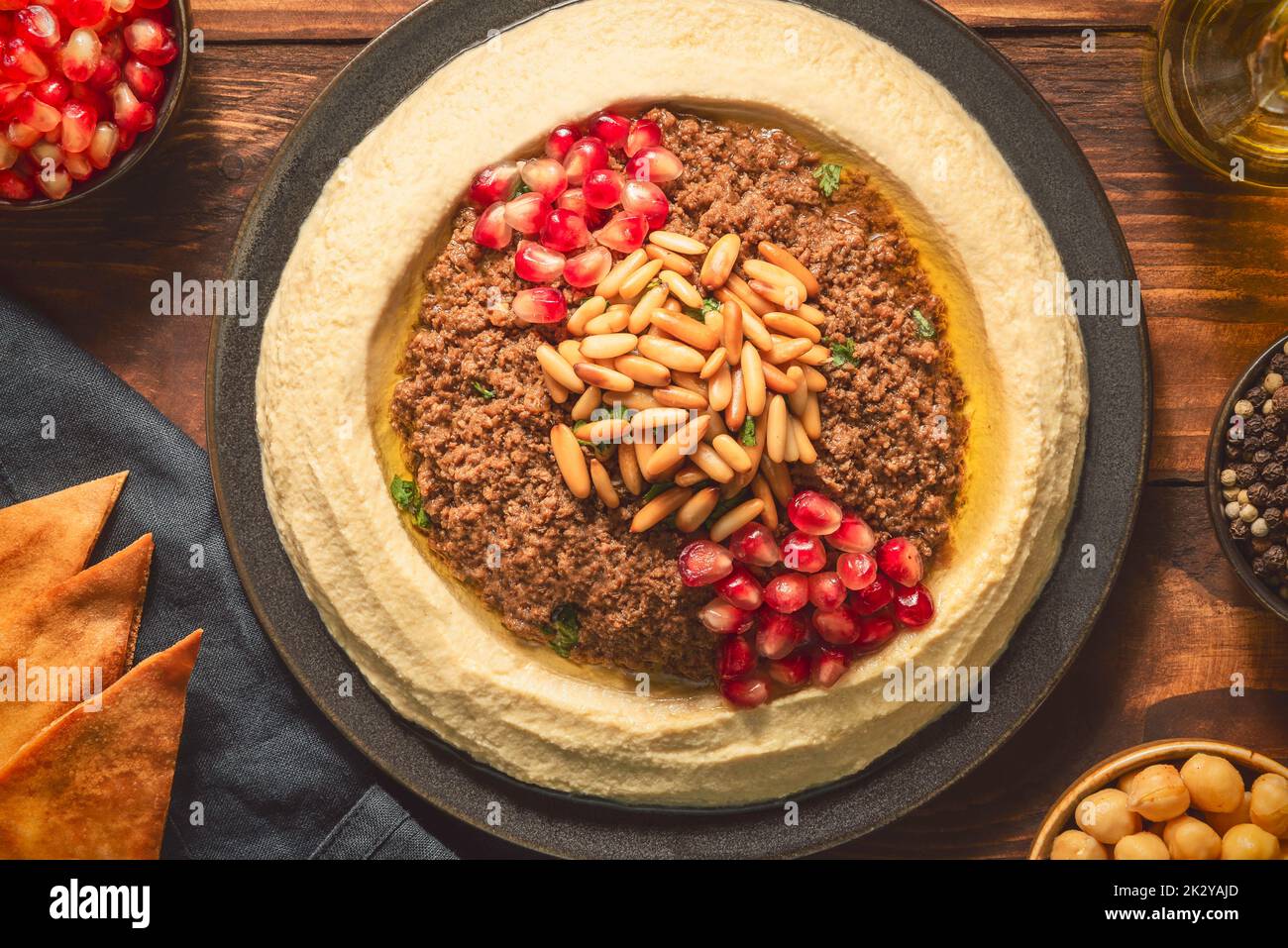 Arabic cuisine; Traditional creamy hummus dip with ground beef. Topped