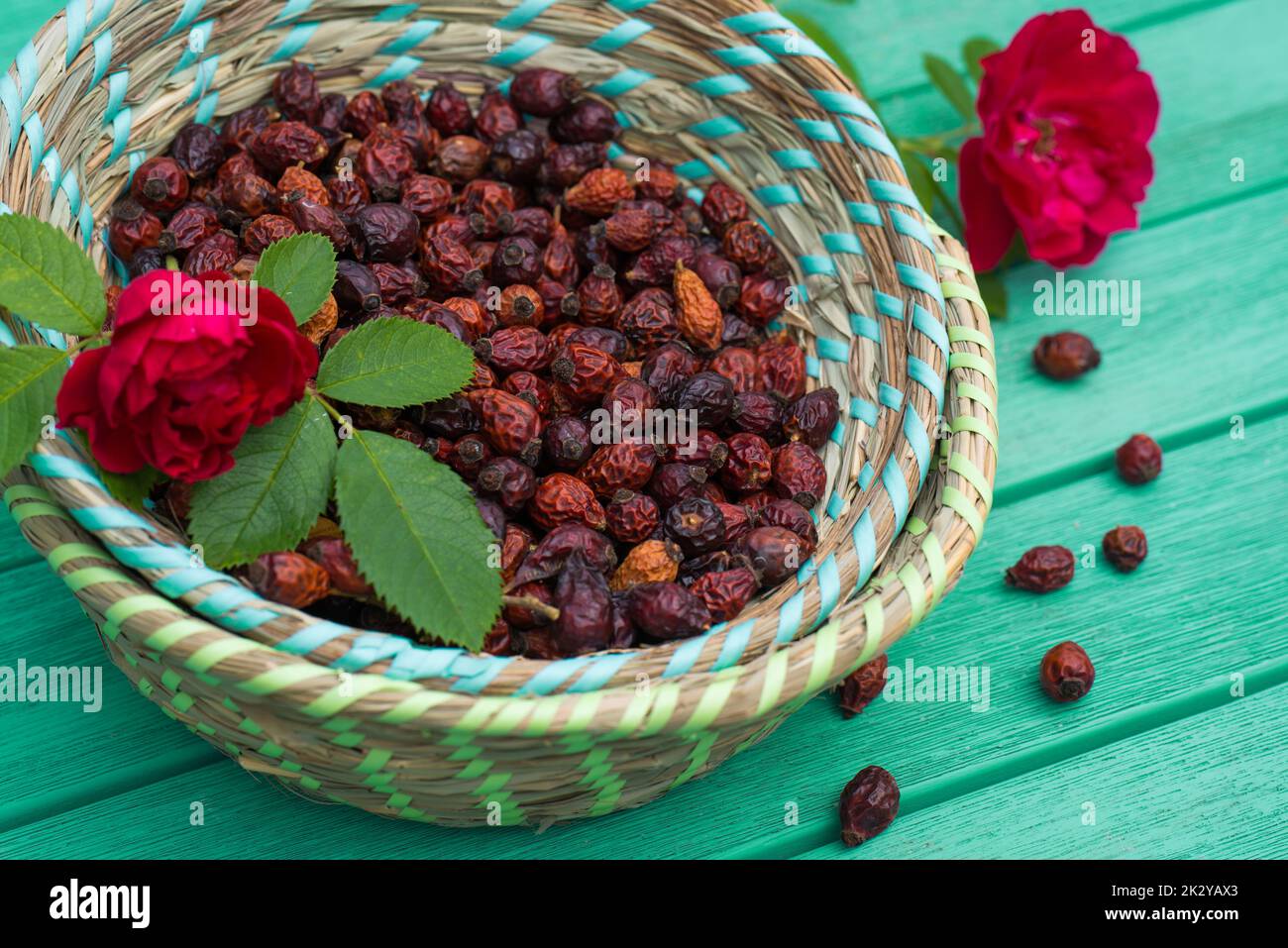 Many rose hips in a basket Stock Photo