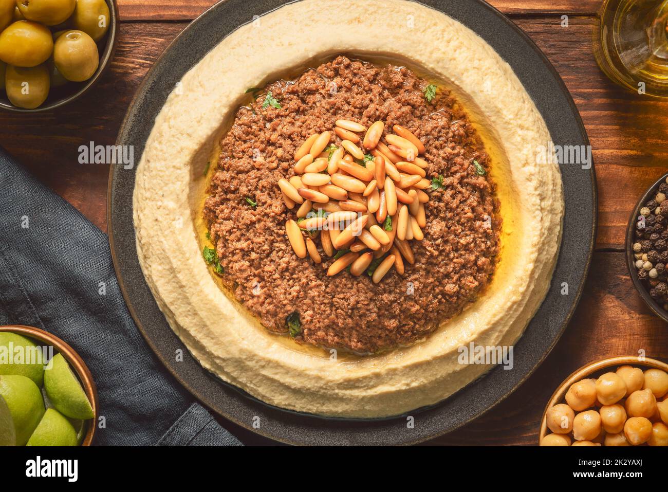Arabic cuisine; Traditional creamy hummus dip with ground beef. Topped