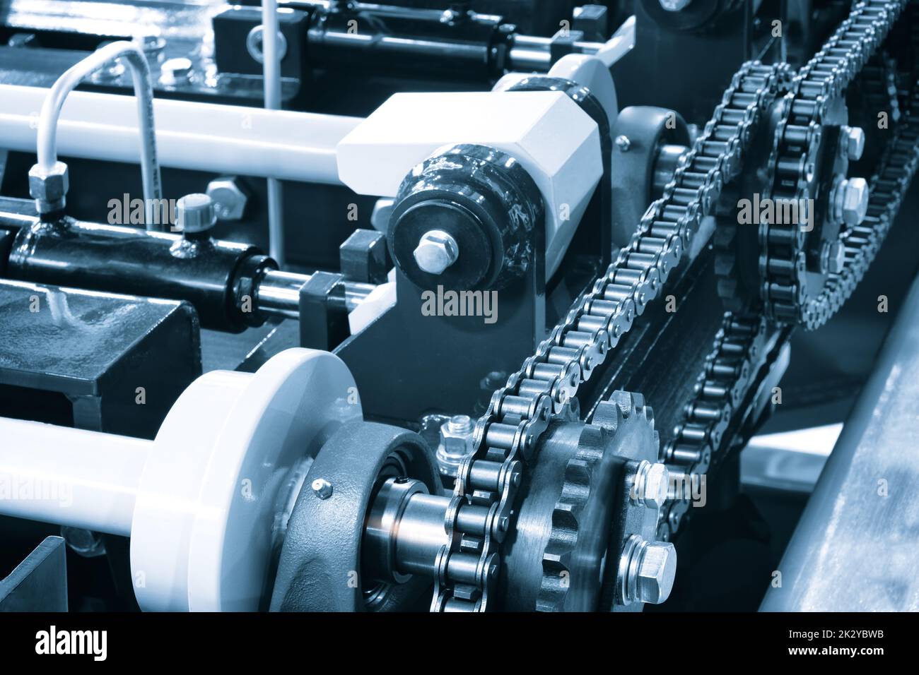 Gear chain drive shaft in conveyor belt is on production line. Timing