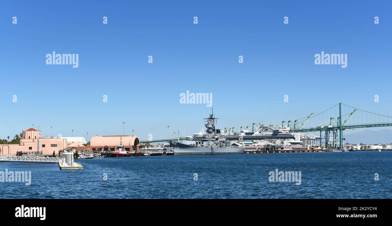 SAN PEDRO, CALIFORNIA - 21 SEP 2022: The Battleship Iowa, and the Maritime Museum With the Vincent Thomas Bridge in the Main Channel of the Port of Lo Stock Photo