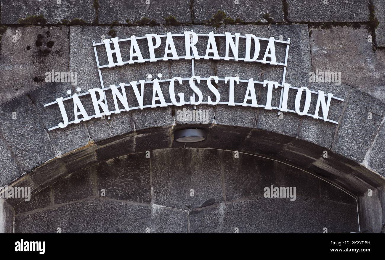Close-up view of the sign at the entrance to the Haparanda railroad station.. Stock Photo