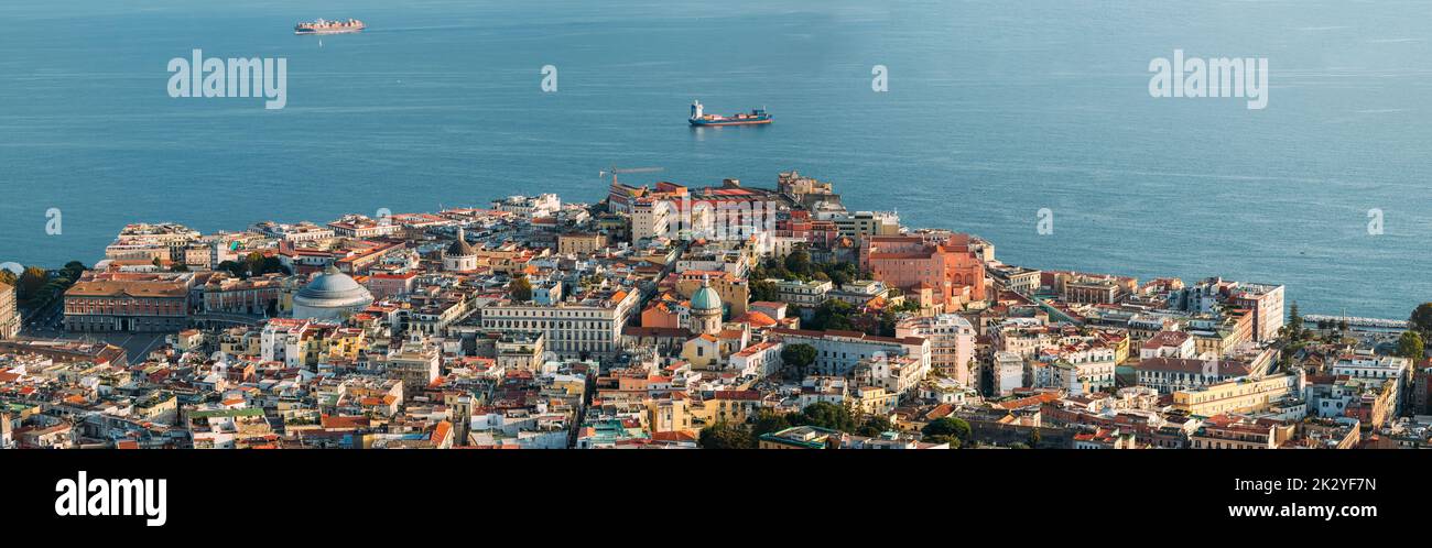 Naples, Italy. Top View Cityscape Skyline With Famous Landmarks And Part Of Gulf Of Naples In Sunny Day. Many Old Churches And Temples Stock Photo