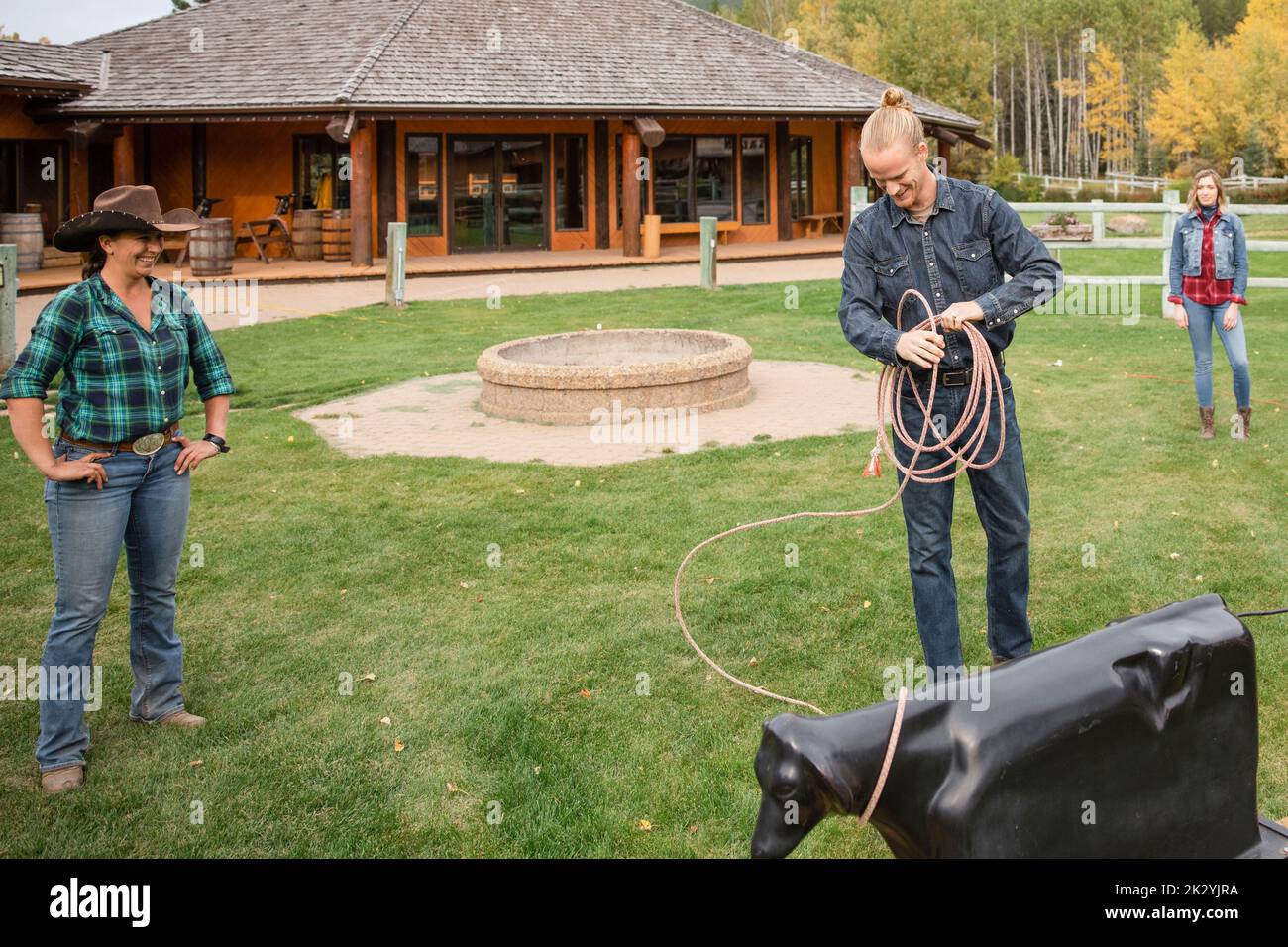 Ranchers practicing calf roping on autumn ranch Stock Photo Alamy