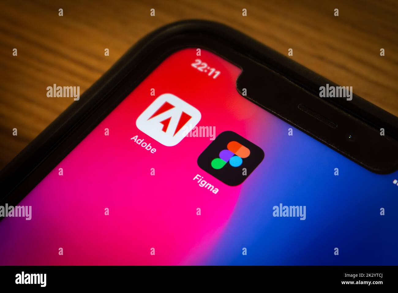 Vancouver, CANADA - Sep 23 2022 : Adobe & Figma icons on an iPhone in dark mood. In Sep 2022, Figma announced that it was being acquired by Adobe Inc. Stock Photo