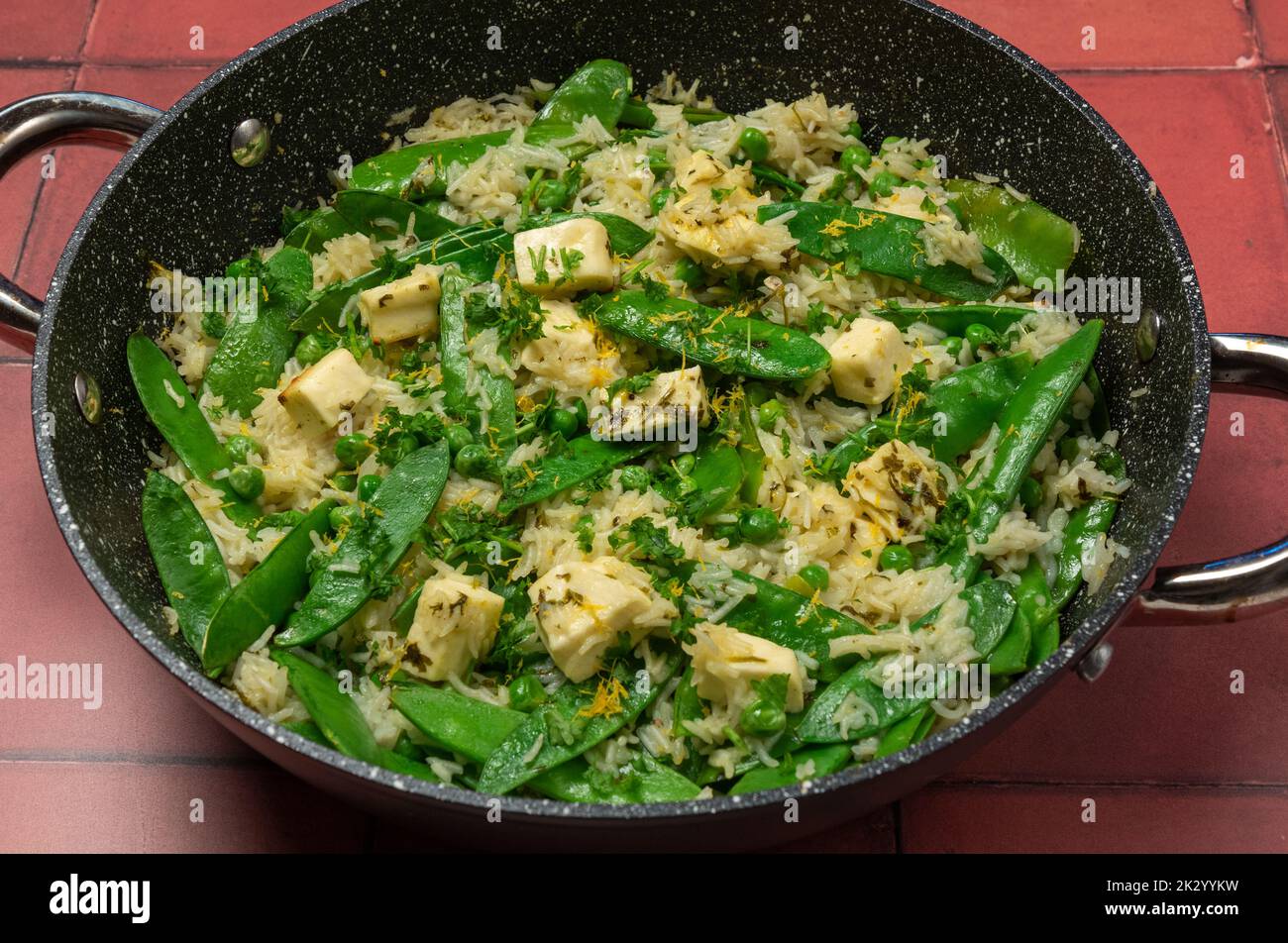 Herby paneer baked rice Stock Photo Alamy