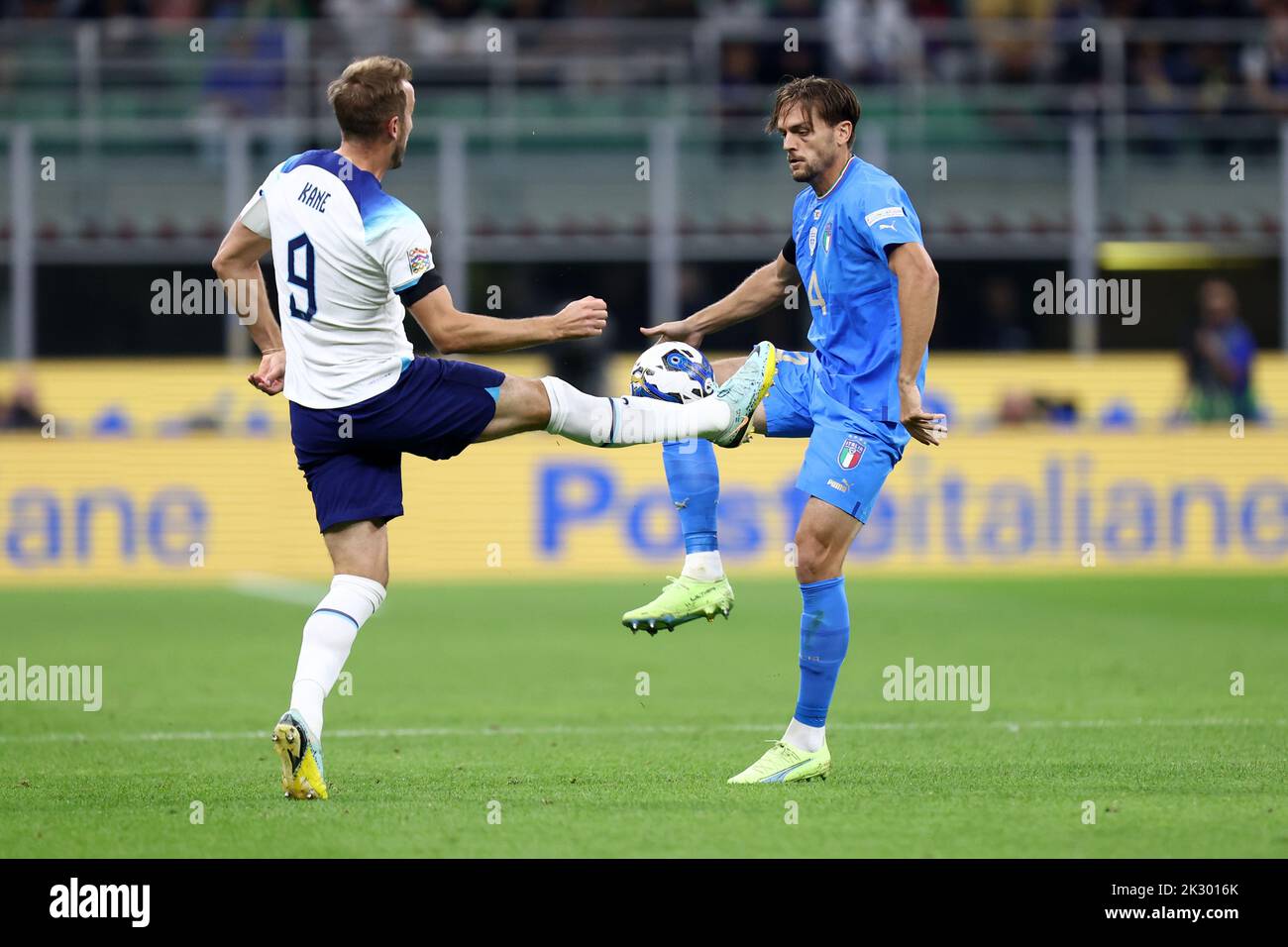 Milan, Italy. 23rd Sep, 2022. Harry Kane of England  and Rafael Toloi of Italy battle for the ball during the Uefa Nations League Group 3 match between Italy and England at Stadio Giuseppe Meazza on September 23, 2022 in Milano Italy . Credit: Marco Canoniero/Alamy Live News Stock Photo