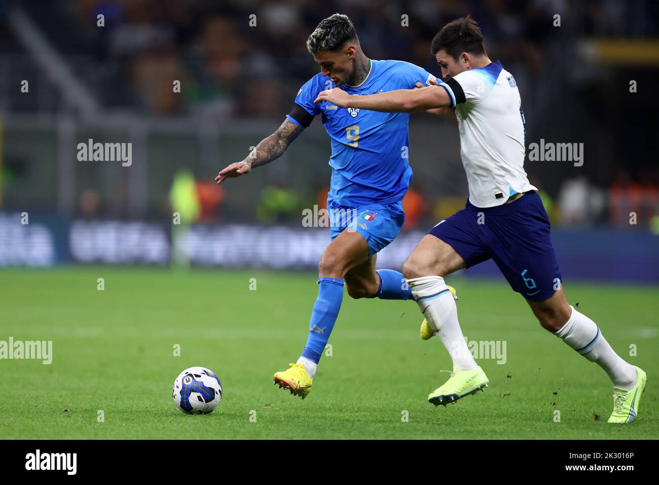 Milan, Italy. 23rd Sep, 2022. Harry Maguire of England battle and Gianluca Scamacca of Italy for the ball during the Uefa Nations League Group 3 match between Italy and England at Stadio Giuseppe Meazza on September 23, 2022 in Milano Italy . Credit: Marco Canoniero/Alamy Live News Stock Photo