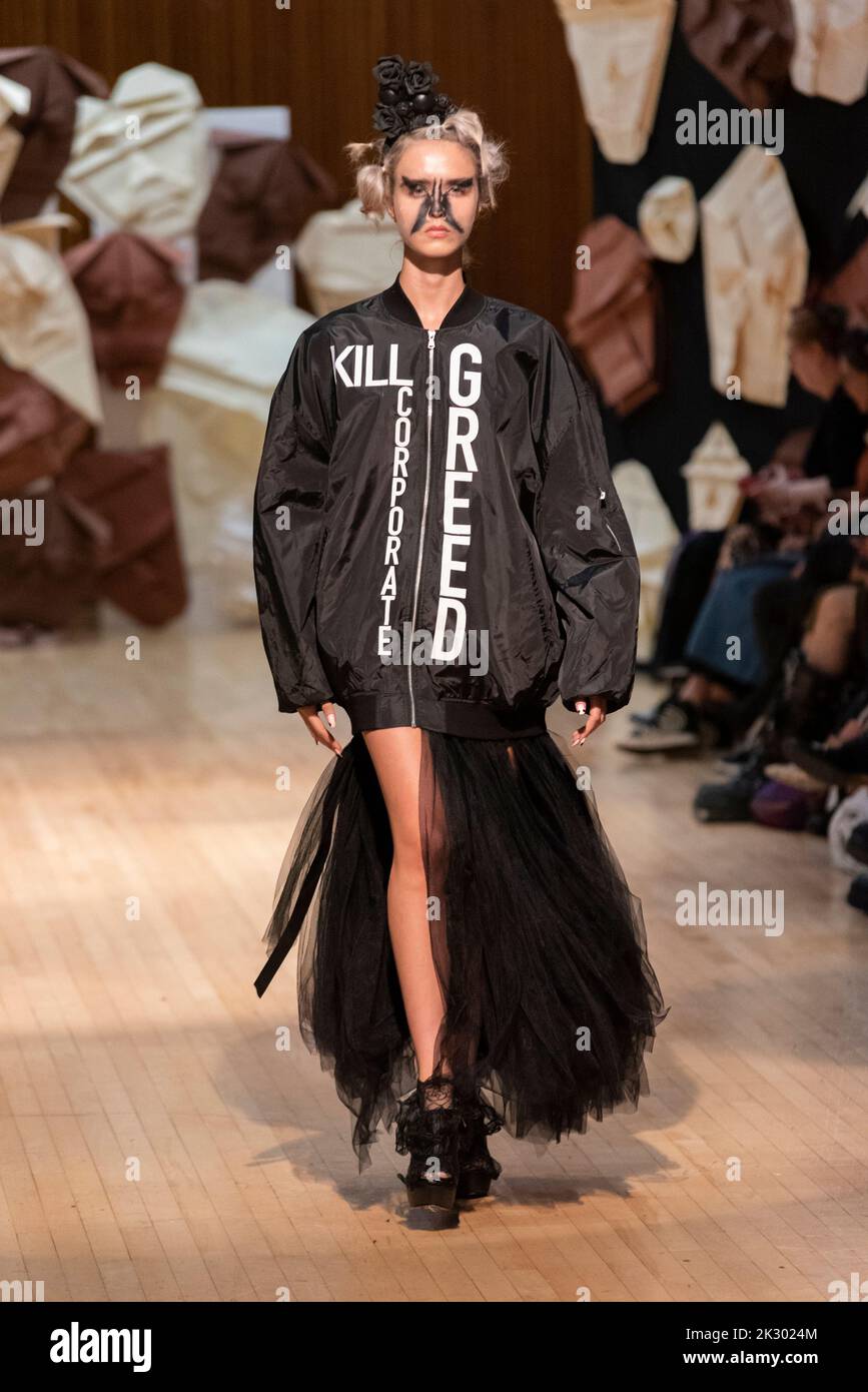 Model, modelling on catwalk for VIN+OMI 'Opinions' show for London Fashion Week 2022. Recycled materials. Sustainable fashion. Kill corporate greed Stock Photo