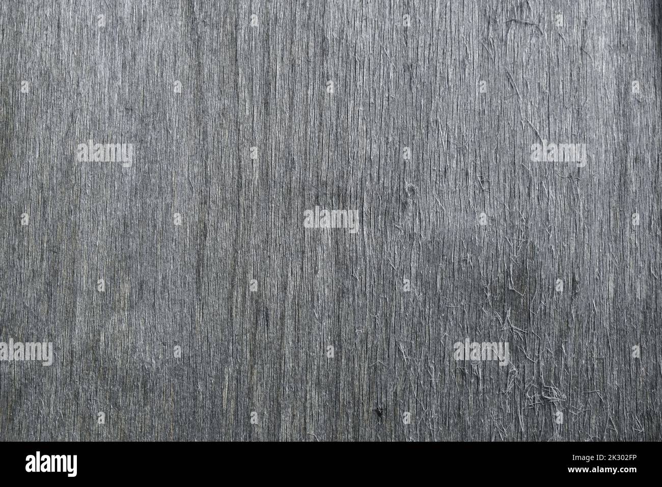 The texture of gray plywood. The texture of the smooth surface of gray plywood. Top view of the old plywood background. Stock Photo