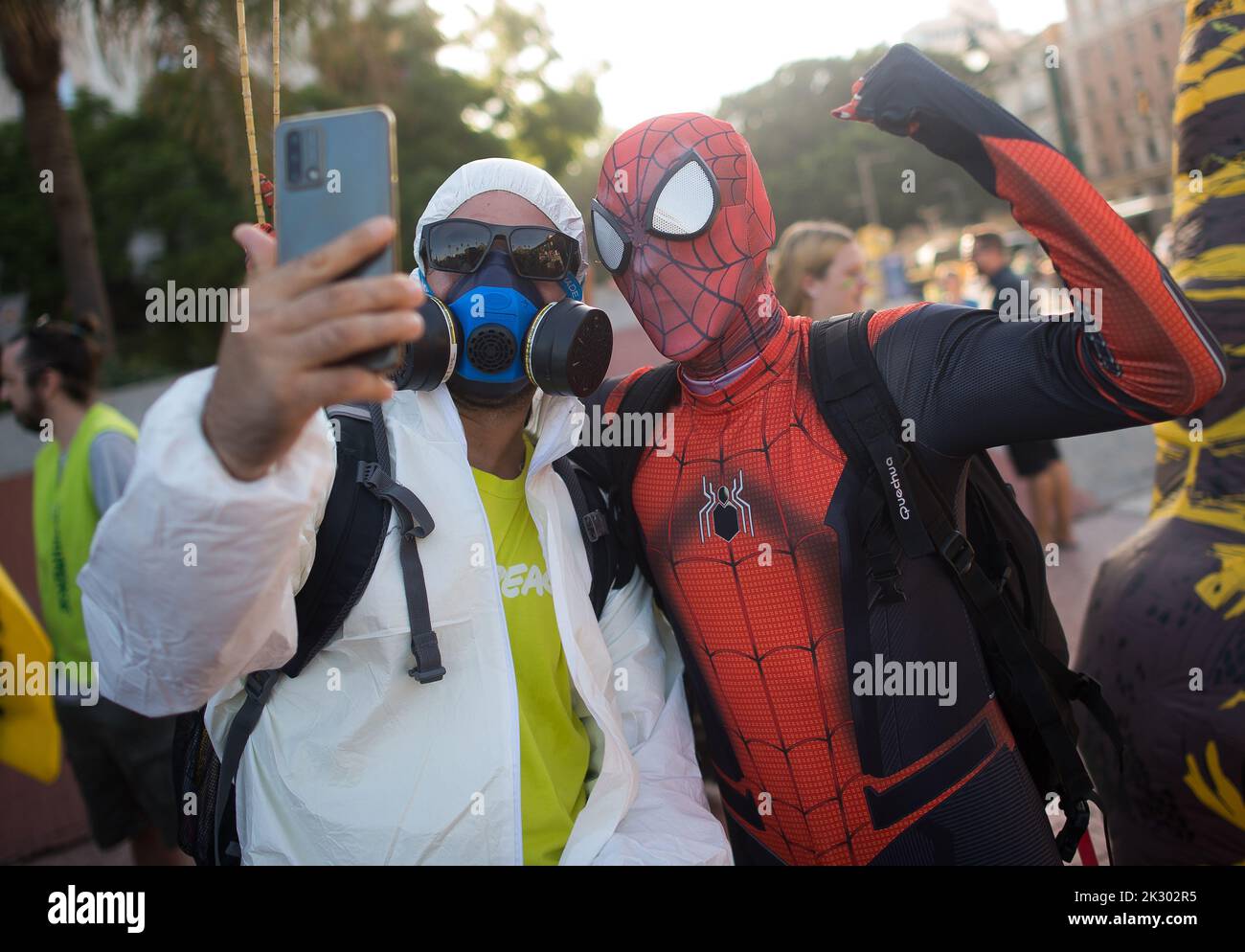 Malaga, Spain. 23rd Sep, 2022. A protester wearing a mask is seen taking a selfie with other protester dressed as Spiderman during a demonstration as part of the global climate actions headed by Fridays For Future movement. Under the slogan: 'democratization of the energy' hundred of people have marched along main streets in support of the global actions for the climate, amid energy and climate crisis. (Photo by Jesus Merida/SOPA Images/Sipa USA) Credit: Sipa USA/Alamy Live News Stock Photo