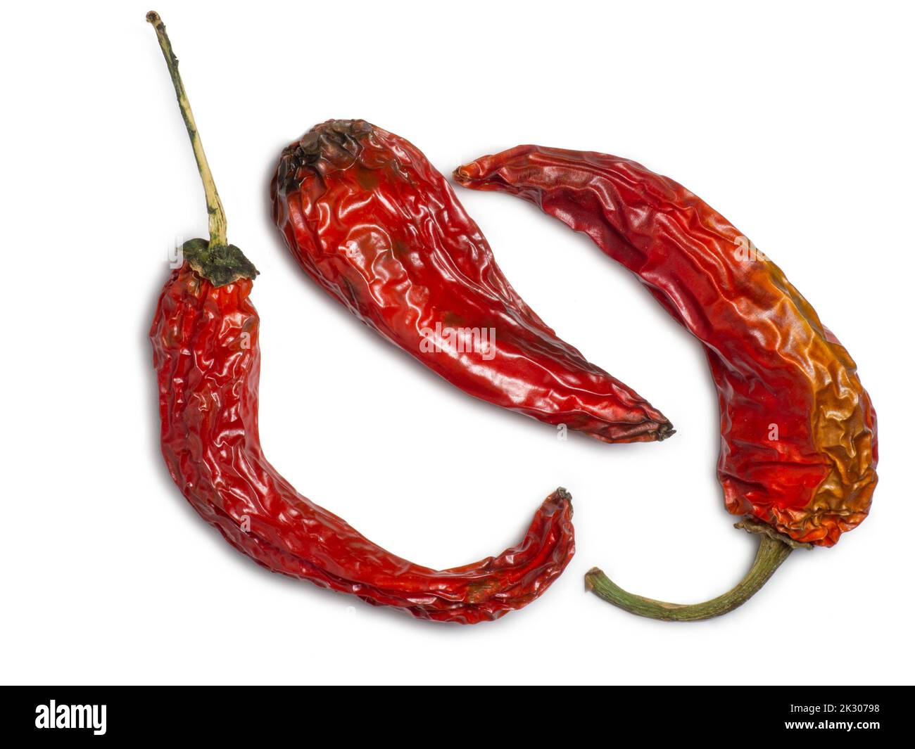 Bunch of dried red peppers on a white background. Spices for dishes