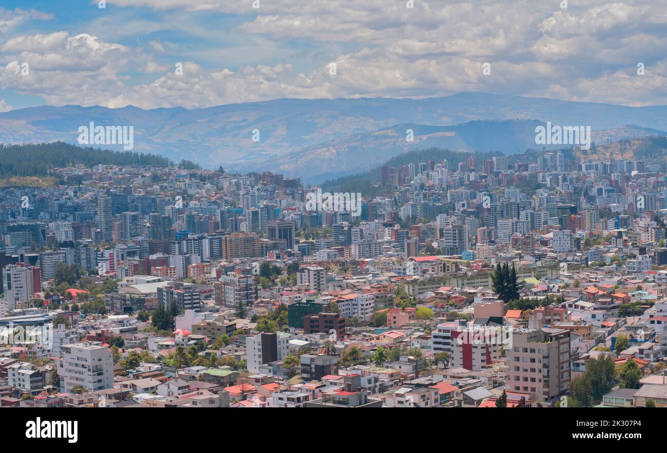 Panoramic view of the north central part of the city of Quito full of modern buildings with the Cumbaya valley in the background during a sunny mornin Stock Photo