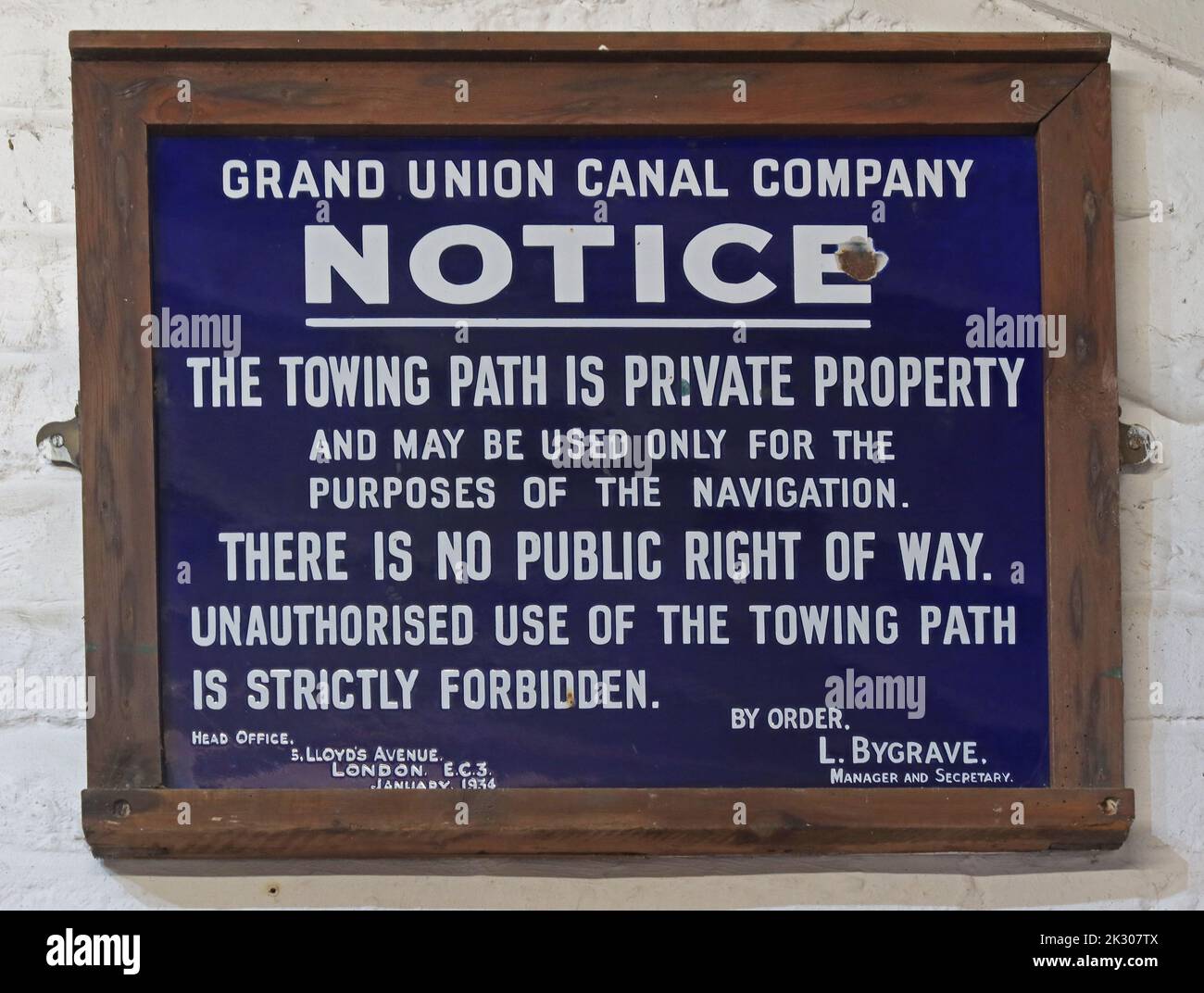 Blue framed Grand Union Canal Company Notice, The towing path is private property, and may be used only for the purposes of the navigation Stock Photo