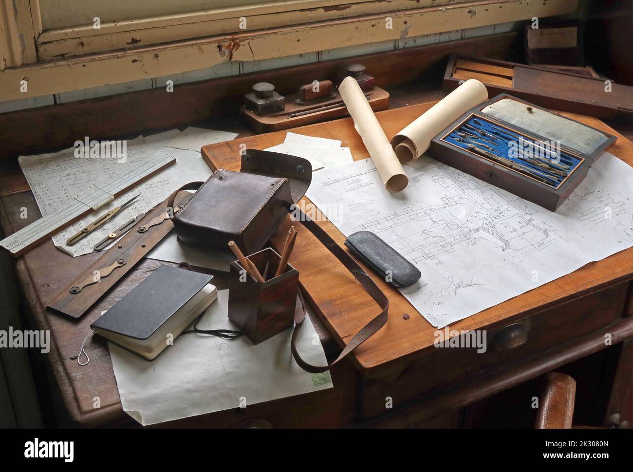 Old fashioned draughtsman's desk, blueprint, engineering drawing, pencils, instruments, rule, office desk ink & tools Stock Photo