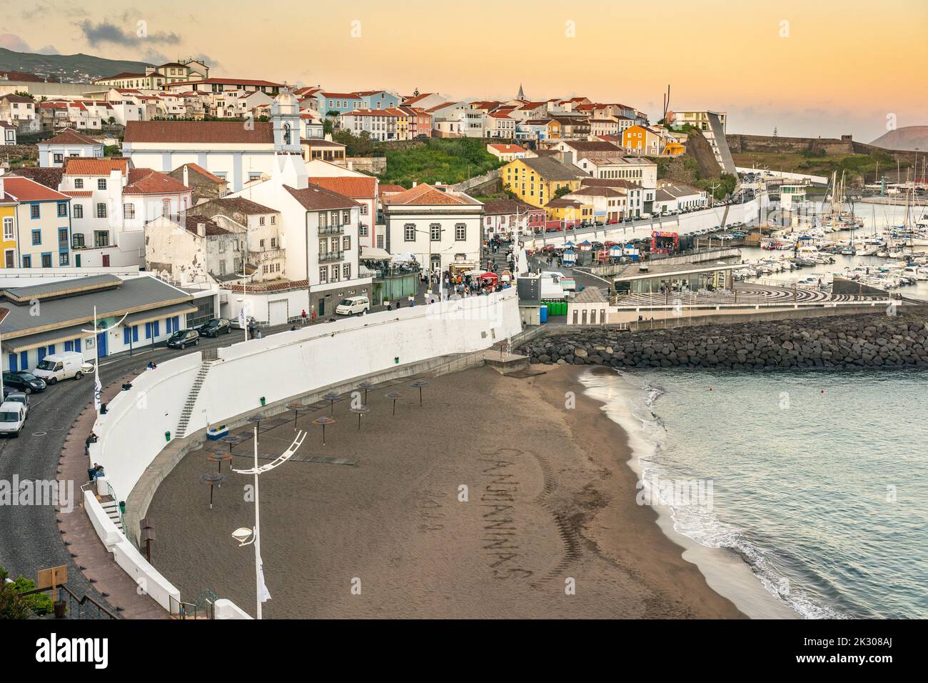 City view of the public beach called the Praia de Angra do Heroismo at sunset in the historic city centre of Angra do Heroismo, Terceira Island, Azores, Portugal. Stock Photo