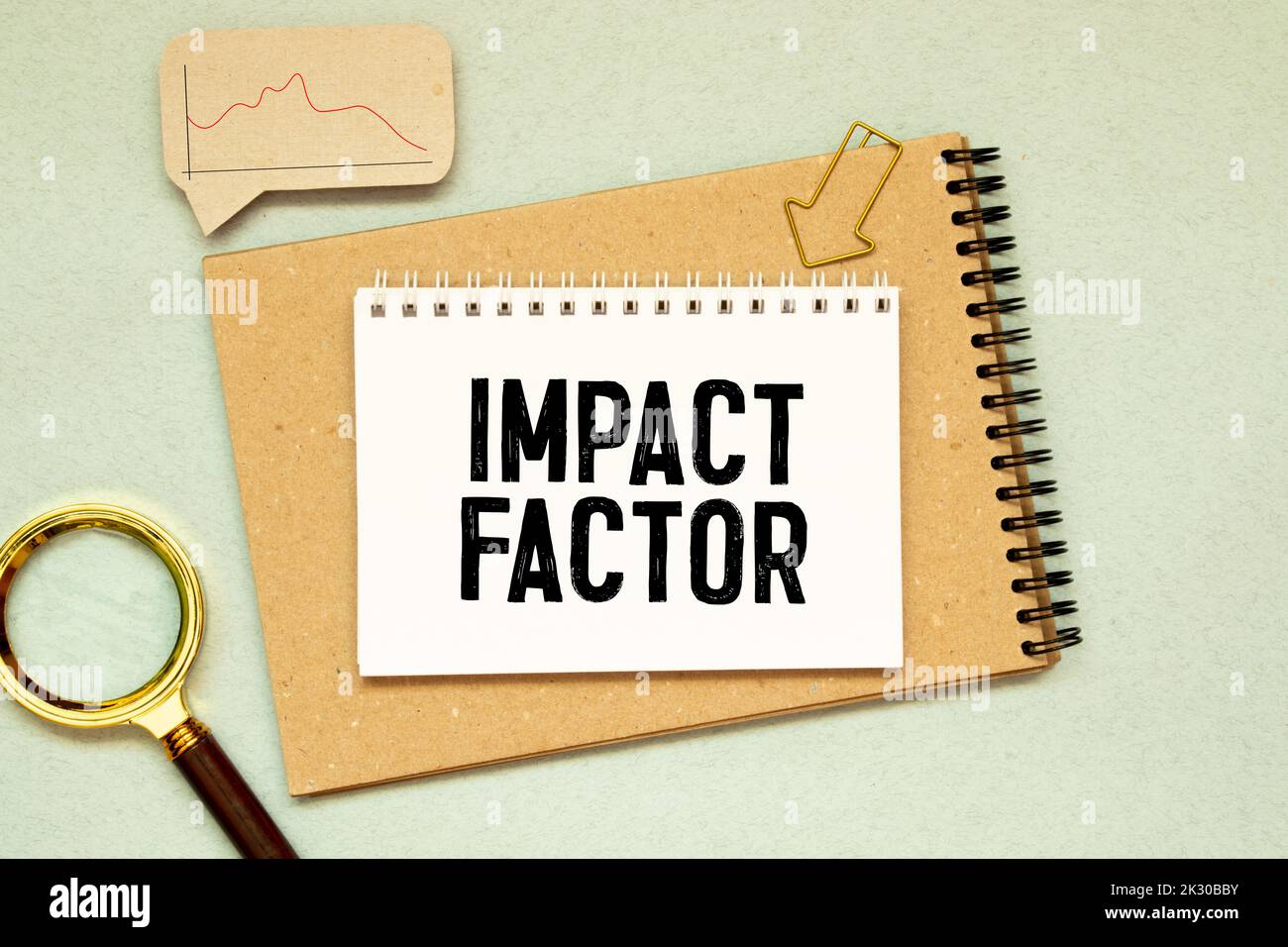 IMPACT FACTOR text written on sticky with pencil and glasses. Stock Photo
