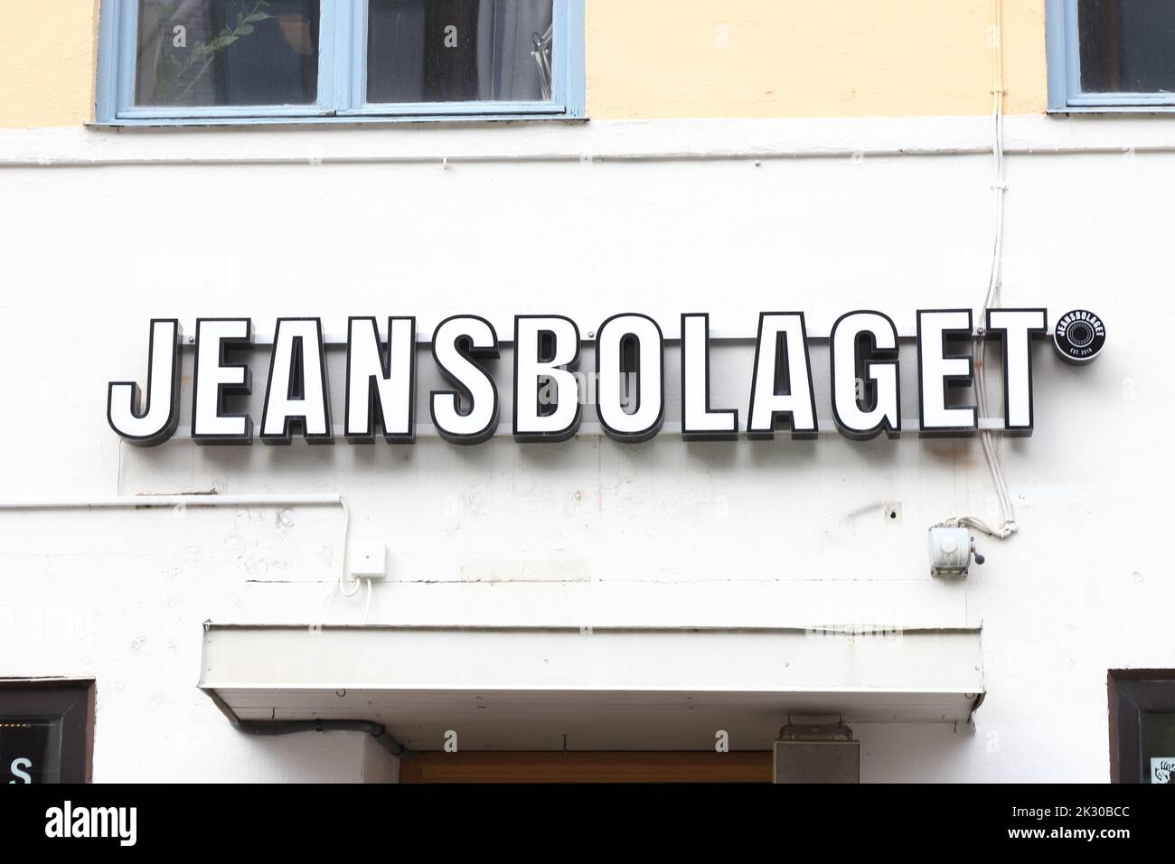Ostersund, Sweden - September 1, 2022: Close-up of the clothing store Jeansbolaget sign. Stock Photo